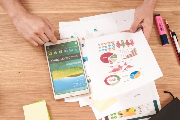 graphs and tablet used for strategy planning